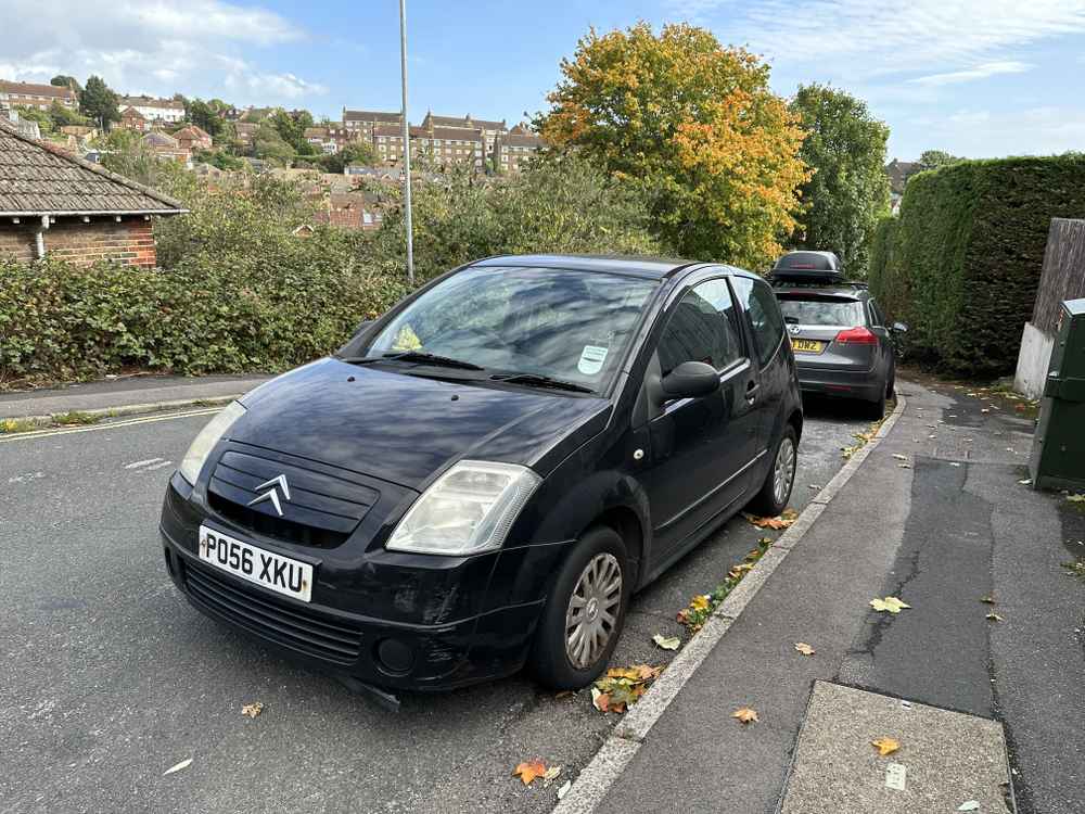 Photograph of PO56 XKU - a Black Citroen C2 parked in Hollingdean by a non-resident. The first of six photographs supplied by the residents of Hollingdean.