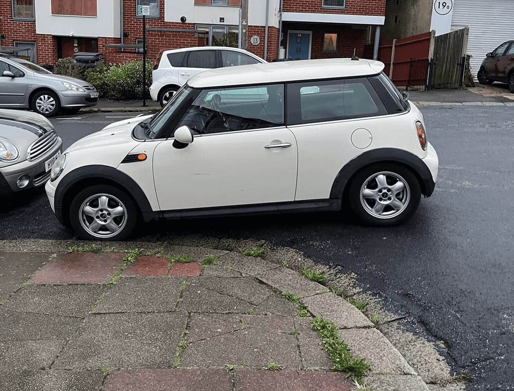 Photograph of BV08 LPO - a White Mini Cooper parked in Hollingdean by a non-resident. The first of two photographs supplied by the residents of Hollingdean.