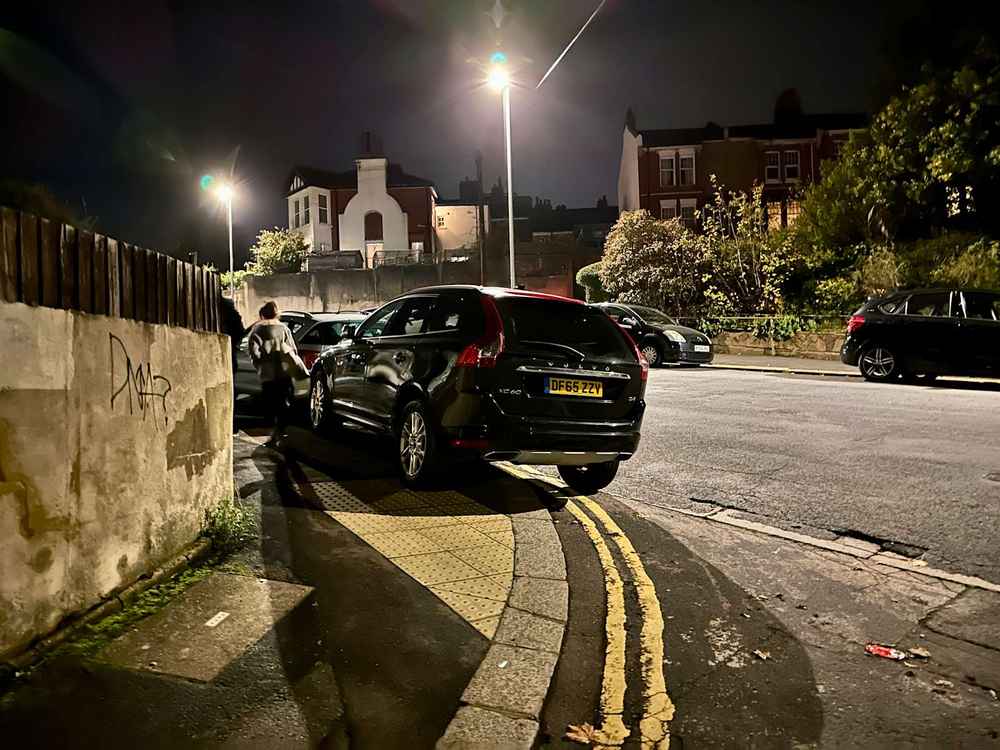 Photograph of DF65 ZZV - a Black Volvo XC60 parked in Hollingdean by a non-resident. The first of eleven photographs supplied by the residents of Hollingdean.