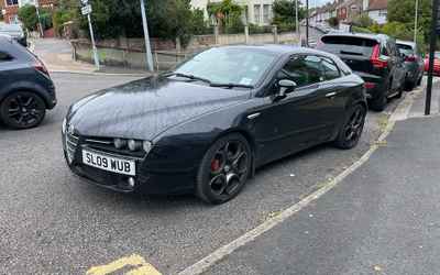 SL09 WUB, a Black Alfa Romeo Brera parked in Hollingdean