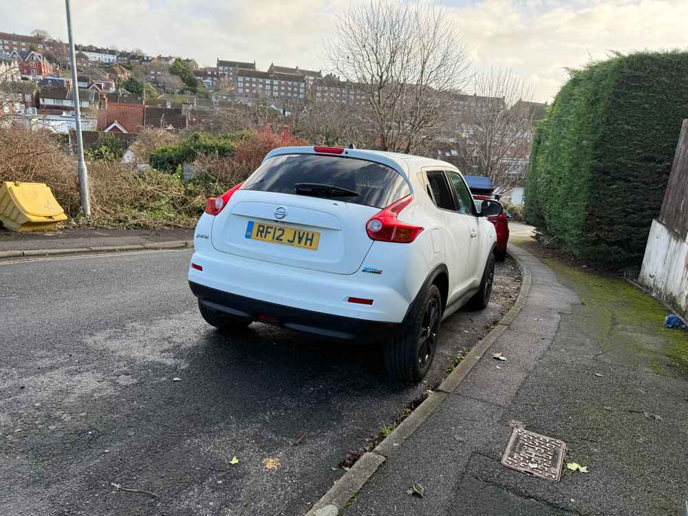Photograph of RF12 JVH - a White Nissan Juke parked in Hollingdean by a non-resident who uses the local area as part of their Brighton commute. The twenty-second of twenty-two photographs supplied by the residents of Hollingdean.