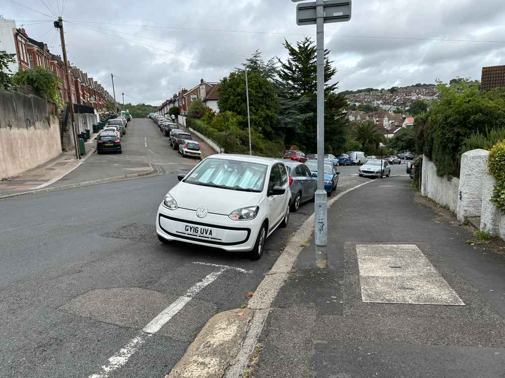 Photograph of GY16 UVA - a White Volkswagen Up parked in Hollingdean by a non-resident. The second of three photographs supplied by the residents of Hollingdean.