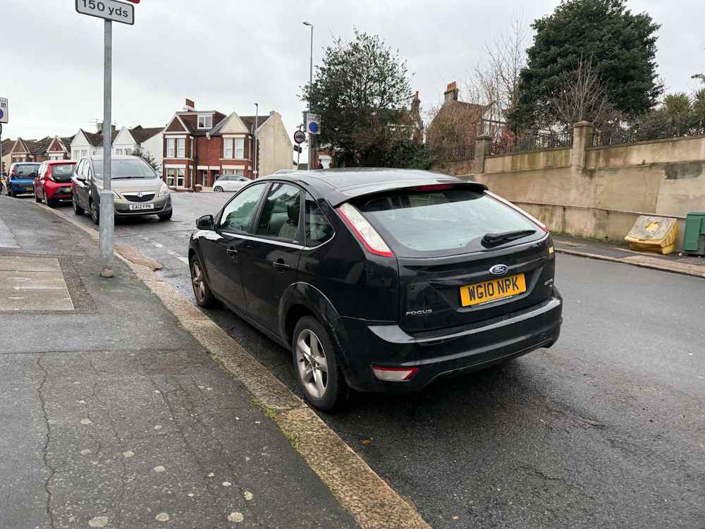 Photograph of WG10 NPK - a Black Ford Focus parked in Hollingdean by a non-resident. The fourth of seventeen photographs supplied by the residents of Hollingdean.