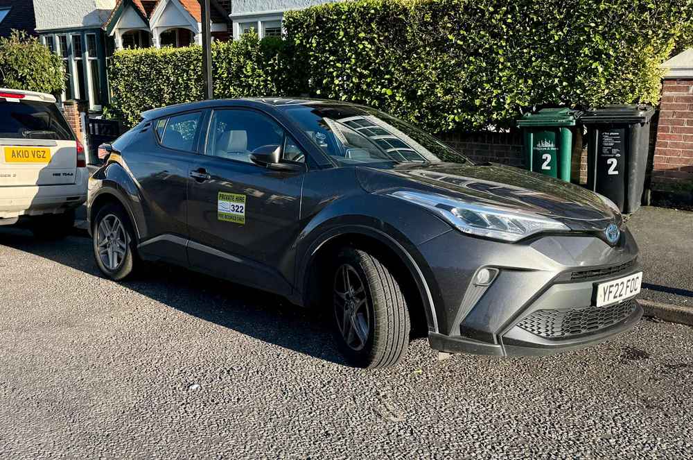 Photograph of YF22 FOC - a Grey Toyota C-HR taxi parked in Hollingdean by a non-resident. The third of nine photographs supplied by the residents of Hollingdean.