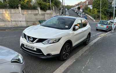 WG14 NSF, a White Nissan Qashqai parked in Hollingdean