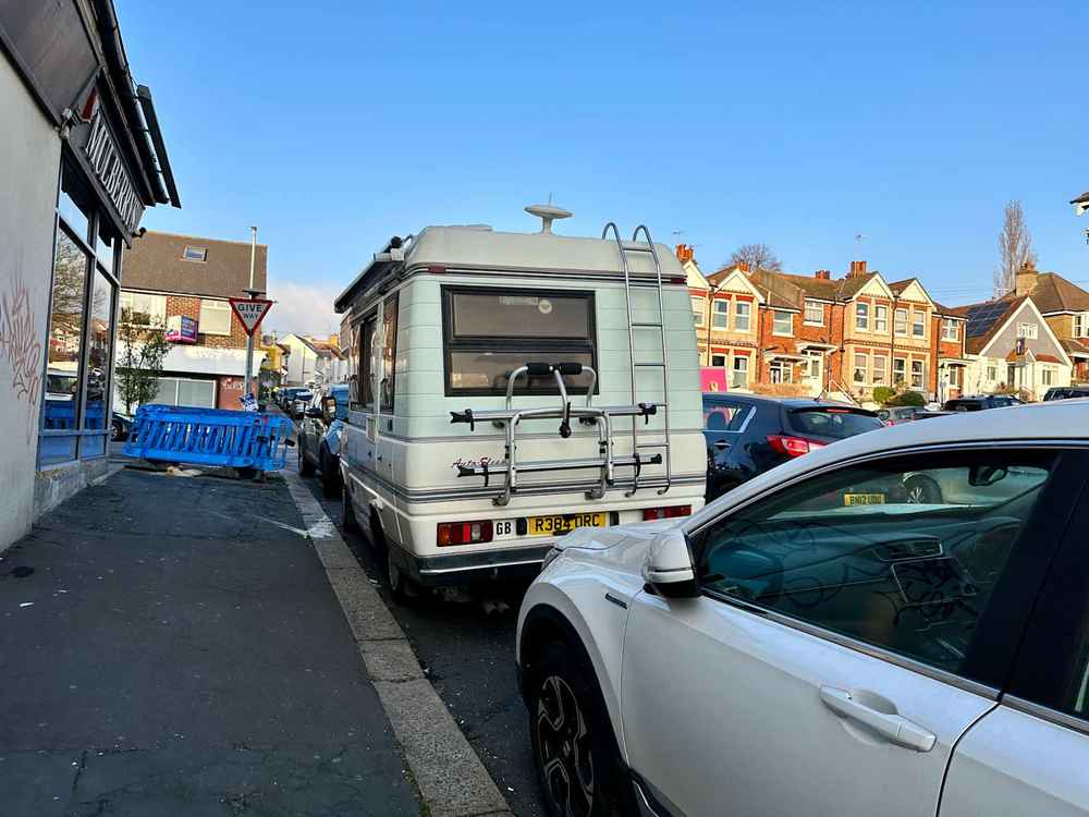 Photograph of R384 ORC - a Beige Volkswagen Transporter camper van parked in Hollingdean by a non-resident, and potentially abandoned. The twelfth of fifteen photographs supplied by the residents of Hollingdean.