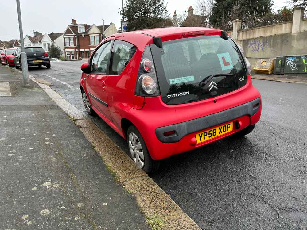 Photograph of YP58 XDF - a Red Citroen C1 parked in Hollingdean by a non-resident, and potentially abandoned. The fourth of seven photographs supplied by the residents of Hollingdean.