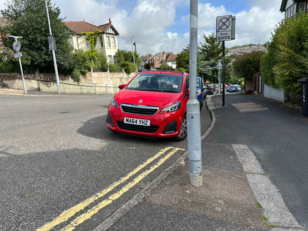 Photograph of MA64 YHZ - a Red Peugeot 108 parked in Hollingdean by a non-resident who uses the local area as part of their Brighton commute. The eighth of nine photographs supplied by the residents of Hollingdean.