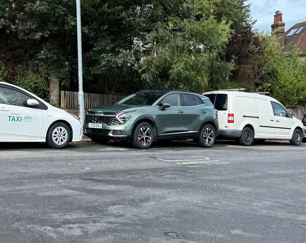 Photograph of LT23 OHJ - a Green Kia Sportage parked in Hollingdean by a non-resident who uses the local area as part of their Brighton commute. The first of three photographs supplied by the residents of Hollingdean.
