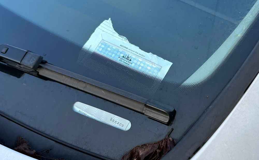 Photograph of HF15 WZL - a White Seat Leon parked in Hollingdean by a non-resident. The first of three photographs supplied by the residents of Hollingdean.