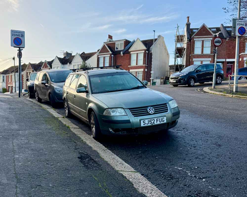 Photograph of SJ52 FUG - a Green Volkswagen Passat parked in Hollingdean by a non-resident, and potentially abandoned. The third of three photographs supplied by the residents of Hollingdean.