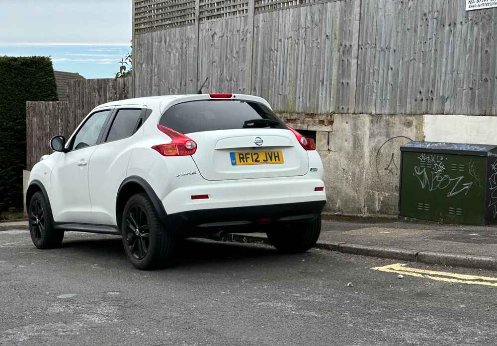 Photograph of RF12 JVH - a White Nissan Juke parked in Hollingdean by a non-resident who uses the local area as part of their Brighton commute. The seventh of eight photographs supplied by the residents of Hollingdean.