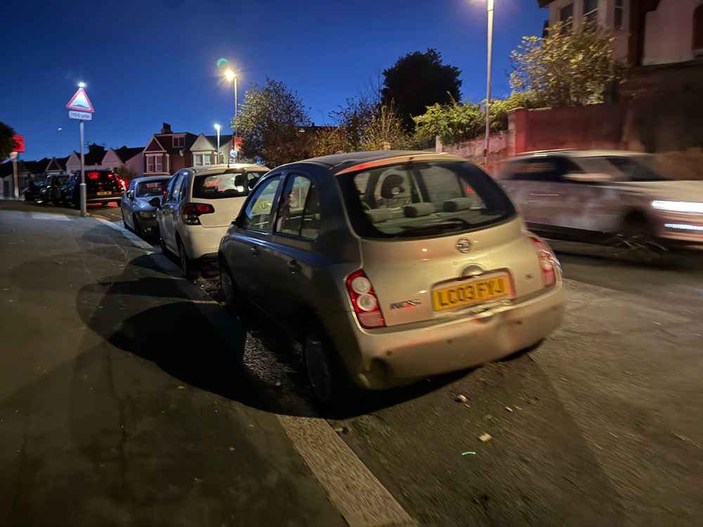 Photograph of LC03 FYJ - a Gold Nissan Micra parked in Hollingdean by a non-resident, and potentially abandoned. The twenty-third of twenty-eight photographs supplied by the residents of Hollingdean.