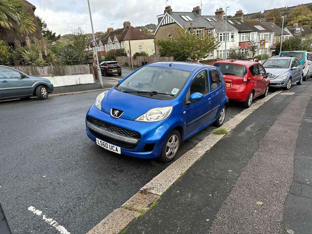 Photograph of LS60 UCA - a Blue Peugeot 107 parked in Hollingdean by a non-resident. The third of thirty photographs supplied by the residents of Hollingdean.