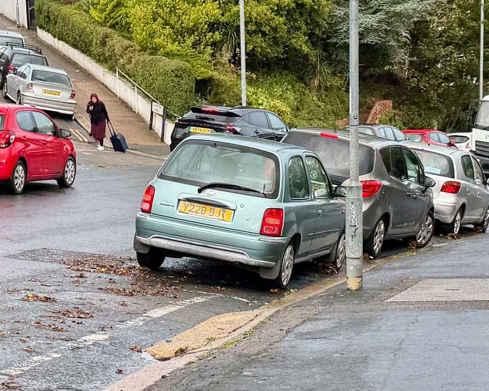 Photograph of Y228 DJT - a Green Nissan Micra parked in Hollingdean by a non-resident, and potentially abandoned. The seventh of nine photographs supplied by the residents of Hollingdean.