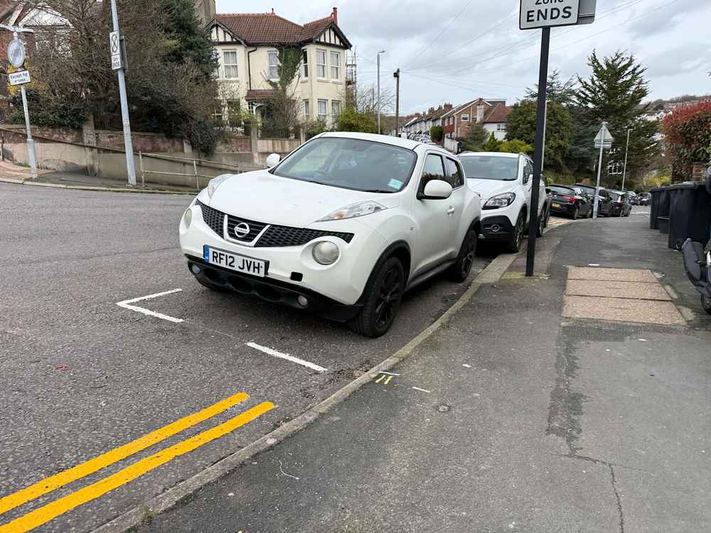 Photograph of RF12 JVH - a White Nissan Juke parked in Hollingdean by a non-resident who uses the local area as part of their Brighton commute. The twenty-sixth of twenty-six photographs supplied by the residents of Hollingdean.