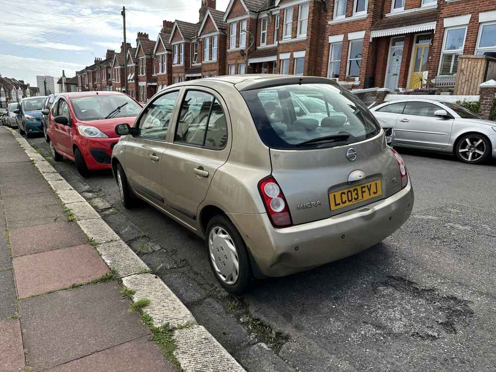 Photograph of LC03 FYJ - a Gold Nissan Micra parked in Hollingdean by a non-resident, and potentially abandoned. The third of twenty-three photographs supplied by the residents of Hollingdean.
