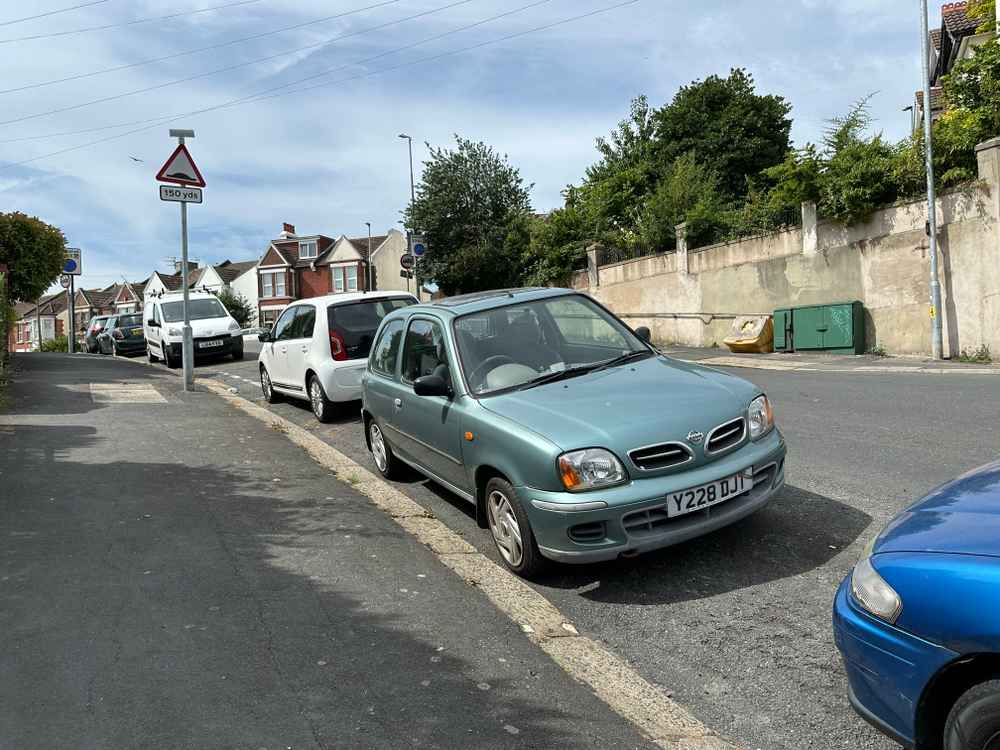 Photograph of Y228 DJT - a Green Nissan Micra parked in Hollingdean by a non-resident, and potentially abandoned. The second of four photographs supplied by the residents of Hollingdean.