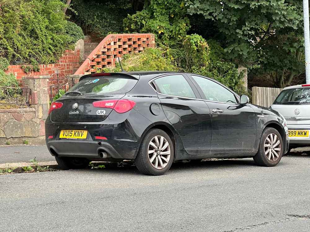 Photograph of VU15 KNV - a Black Alfa Romeo Giulietta parked in Hollingdean by a non-resident. The eighteenth of thirty-four photographs supplied by the residents of Hollingdean.