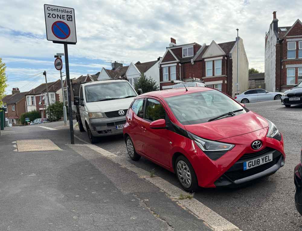 Photograph of GU18 YEL - a Red Toyota Aygo parked in Hollingdean by a non-resident. The third of five photographs supplied by the residents of Hollingdean.