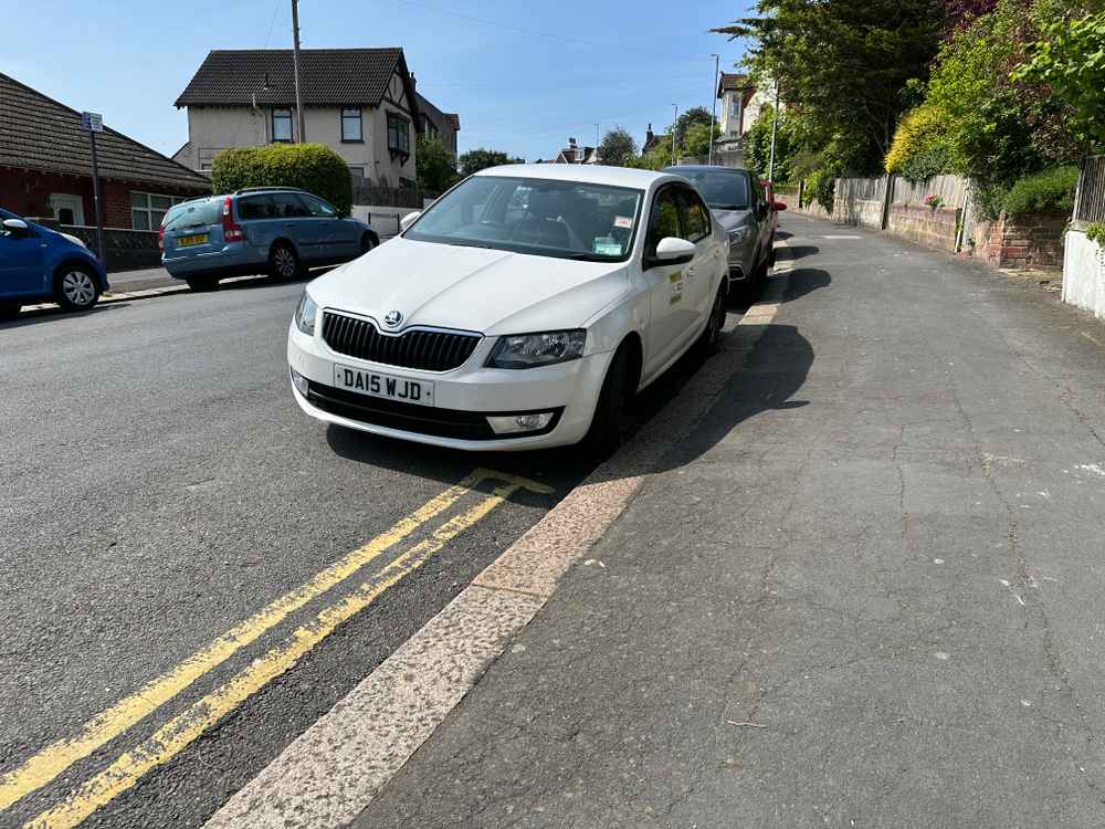 Photograph of DA15 WJD - a White Skoda Octavia taxi parked in Hollingdean by a non-resident. The ninth of ten photographs supplied by the residents of Hollingdean.