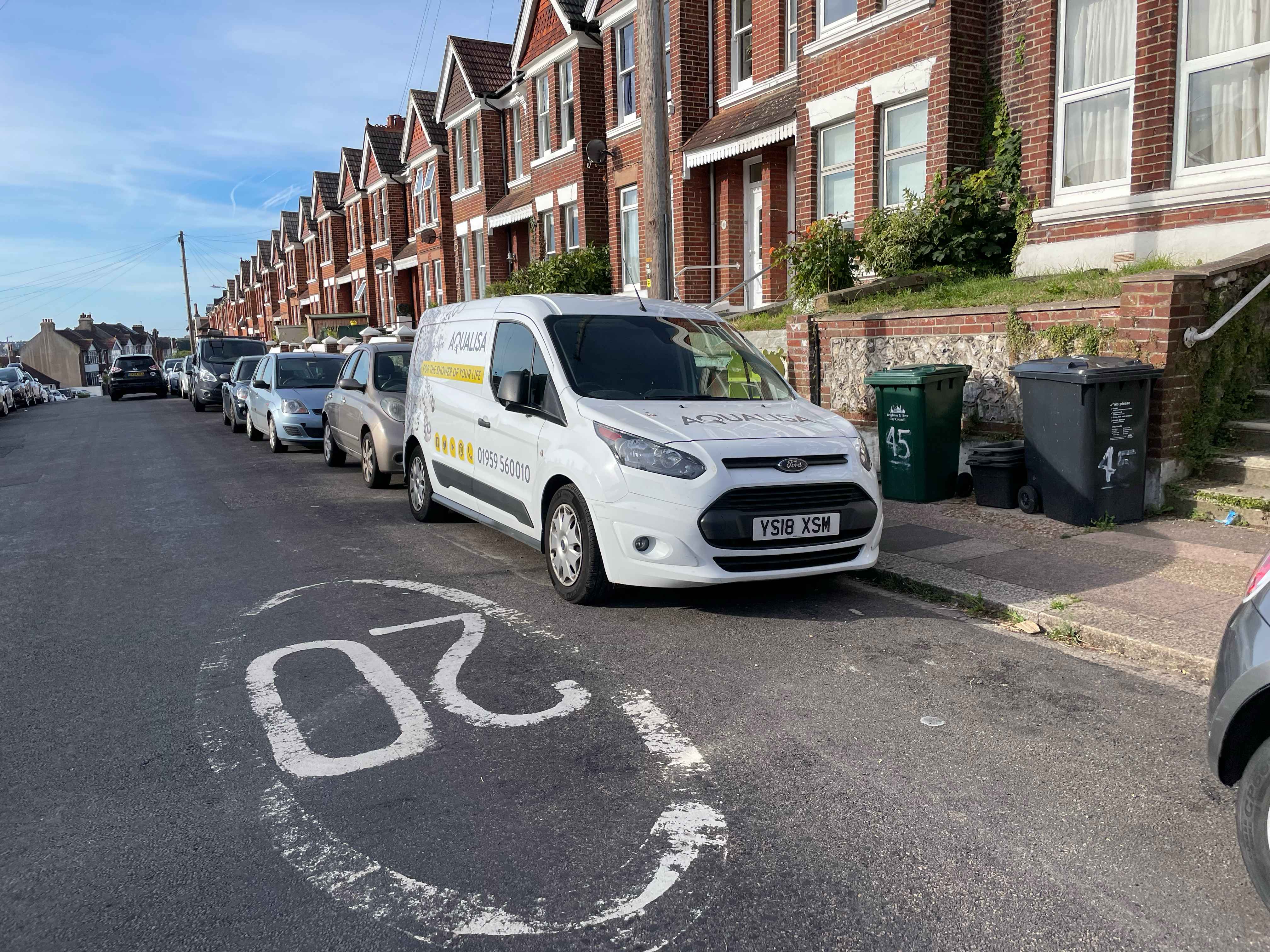Photograph of YS18 XSM - a White Ford Transit Connect parked in Hollingdean by a non-resident. The fifth of five photographs supplied by the residents of Hollingdean.