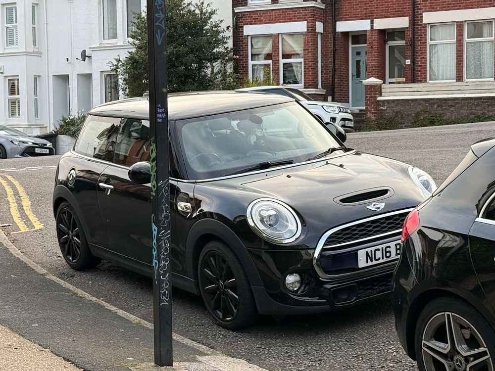 Photograph of NC16 BMU - a Black Mini Cooper parked in Hollingdean by a non-resident who uses the local area as part of their Brighton commute. The seventh of thirteen photographs supplied by the residents of Hollingdean.