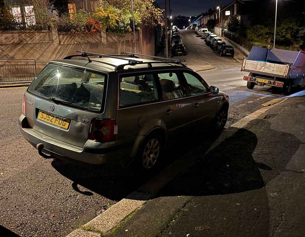 Photograph of SJ52 FUG - a Green Volkswagen Passat parked in Hollingdean by a non-resident, and potentially abandoned. The second of three photographs supplied by the residents of Hollingdean.