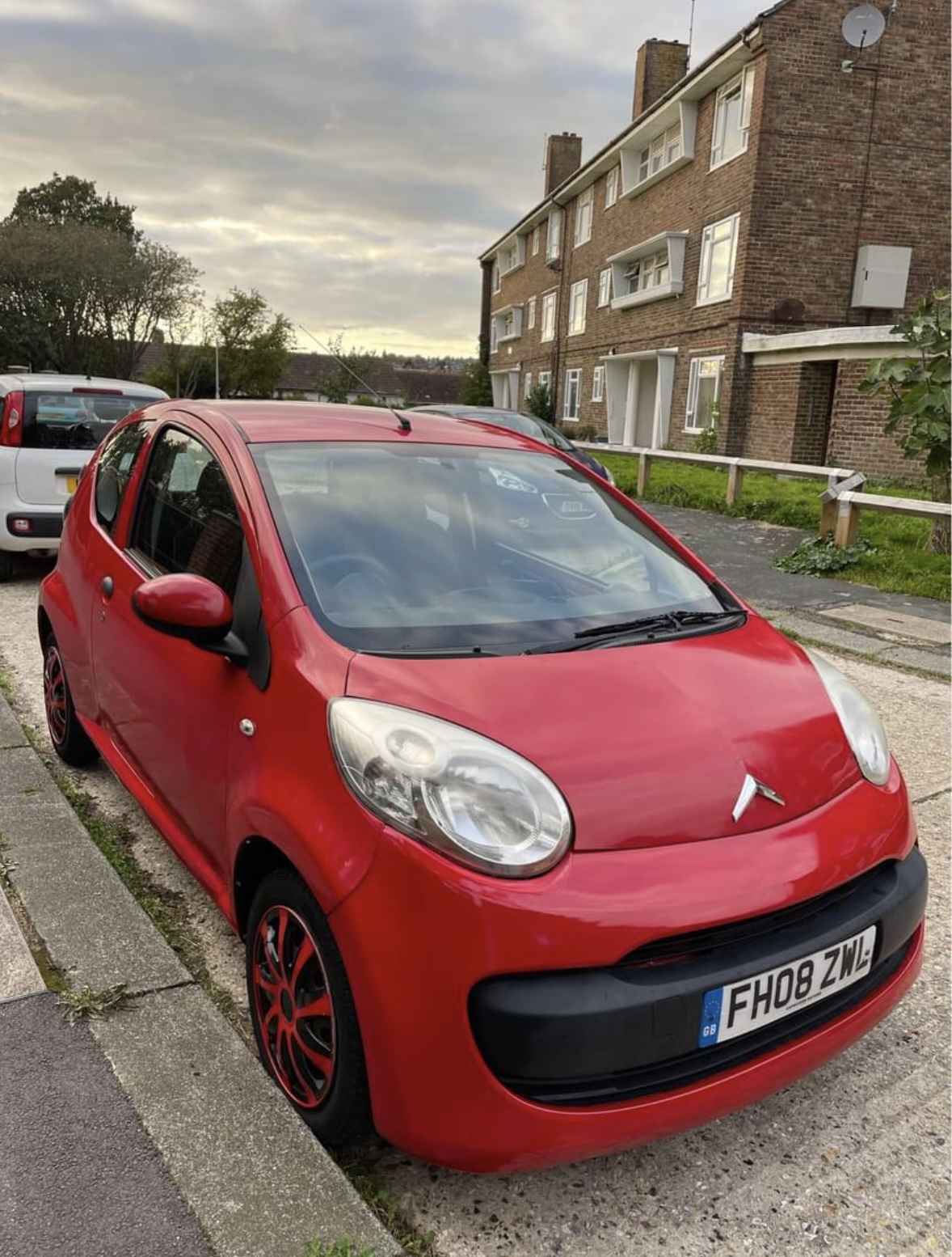 Photograph of FH08 ZWL - a Red Citroen C1 parked in Hollingdean by a non-resident and stored here whilst a dodgy car dealer attempts to sell it. The second of five photographs supplied by the residents of Hollingdean.