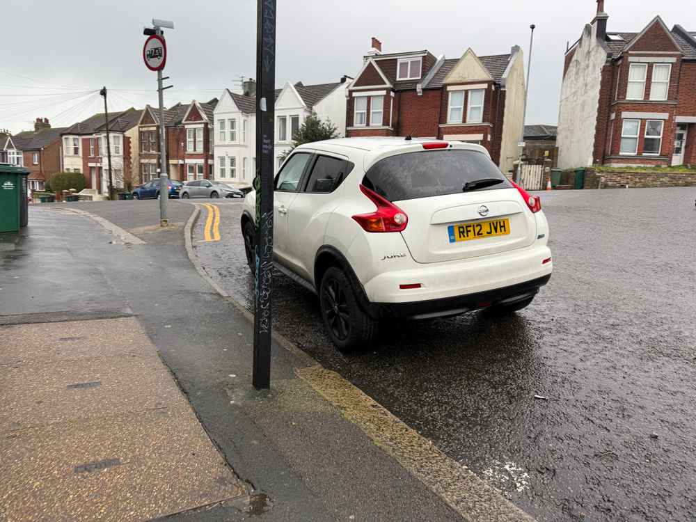 Photograph of RF12 JVH - a White Nissan Juke parked in Hollingdean by a non-resident who uses the local area as part of their Brighton commute. The twelfth of thirteen photographs supplied by the residents of Hollingdean.