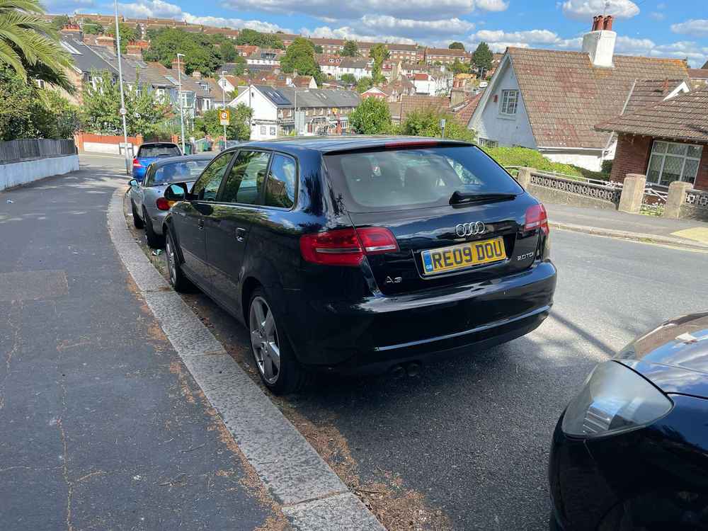 Photograph of RE09 DOU - a Black Audi A3 parked in Hollingdean by a non-resident who uses the local area as part of their Brighton commute. The first of eleven photographs supplied by the residents of Hollingdean.