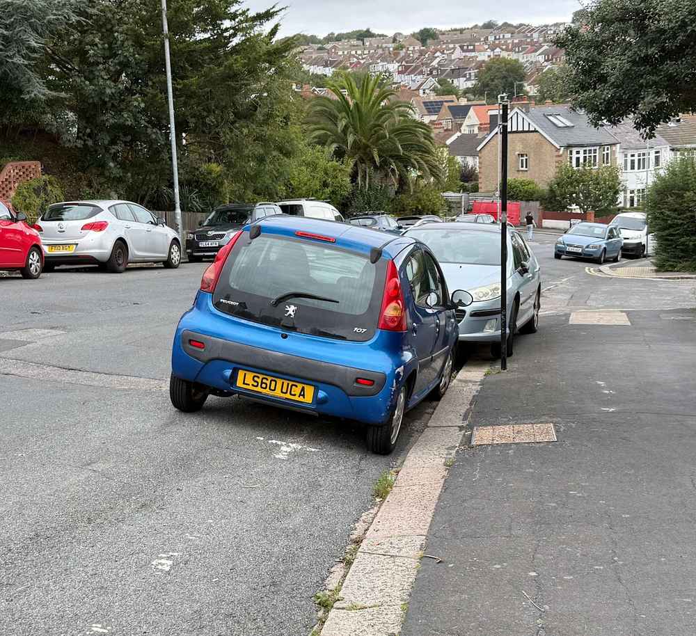 Photograph of LS60 UCA - a Blue Peugeot 107 parked in Hollingdean by a non-resident. The twenty-sixth of thirty photographs supplied by the residents of Hollingdean.
