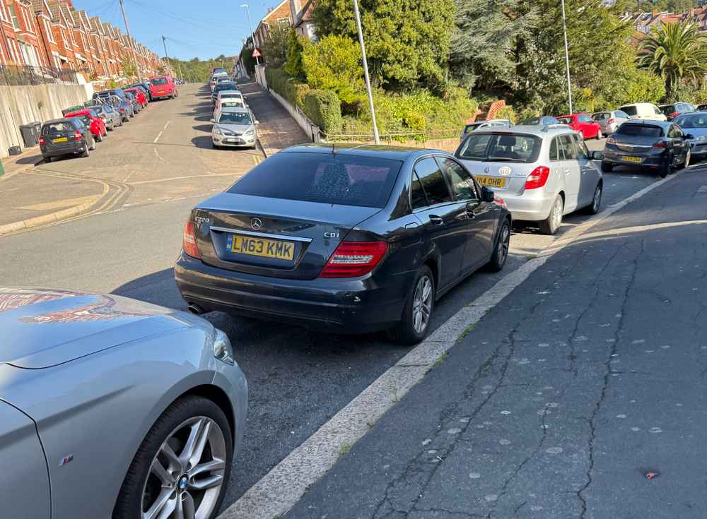 Photograph of LM63 KMK - a Black Mercedes C Class parked in Hollingdean by a non-resident who uses the local area as part of their Brighton commute. The eighth of eight photographs supplied by the residents of Hollingdean.