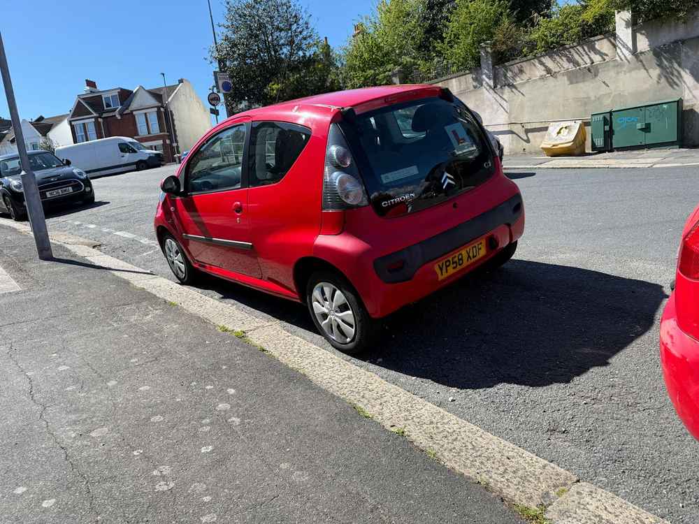 Photograph of YP58 XDF - a Red Citroen C1 parked in Hollingdean by a non-resident, and potentially abandoned. The tenth of twenty photographs supplied by the residents of Hollingdean.