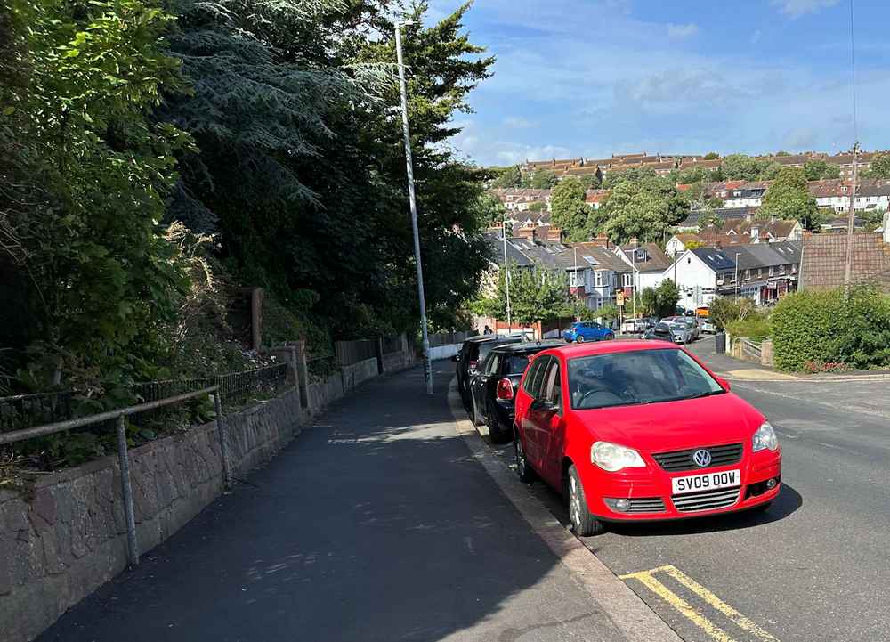 Photograph of SV09 OOW - a Red Volkswagen Polo parked in Hollingdean by a non-resident. The third of four photographs supplied by the residents of Hollingdean.