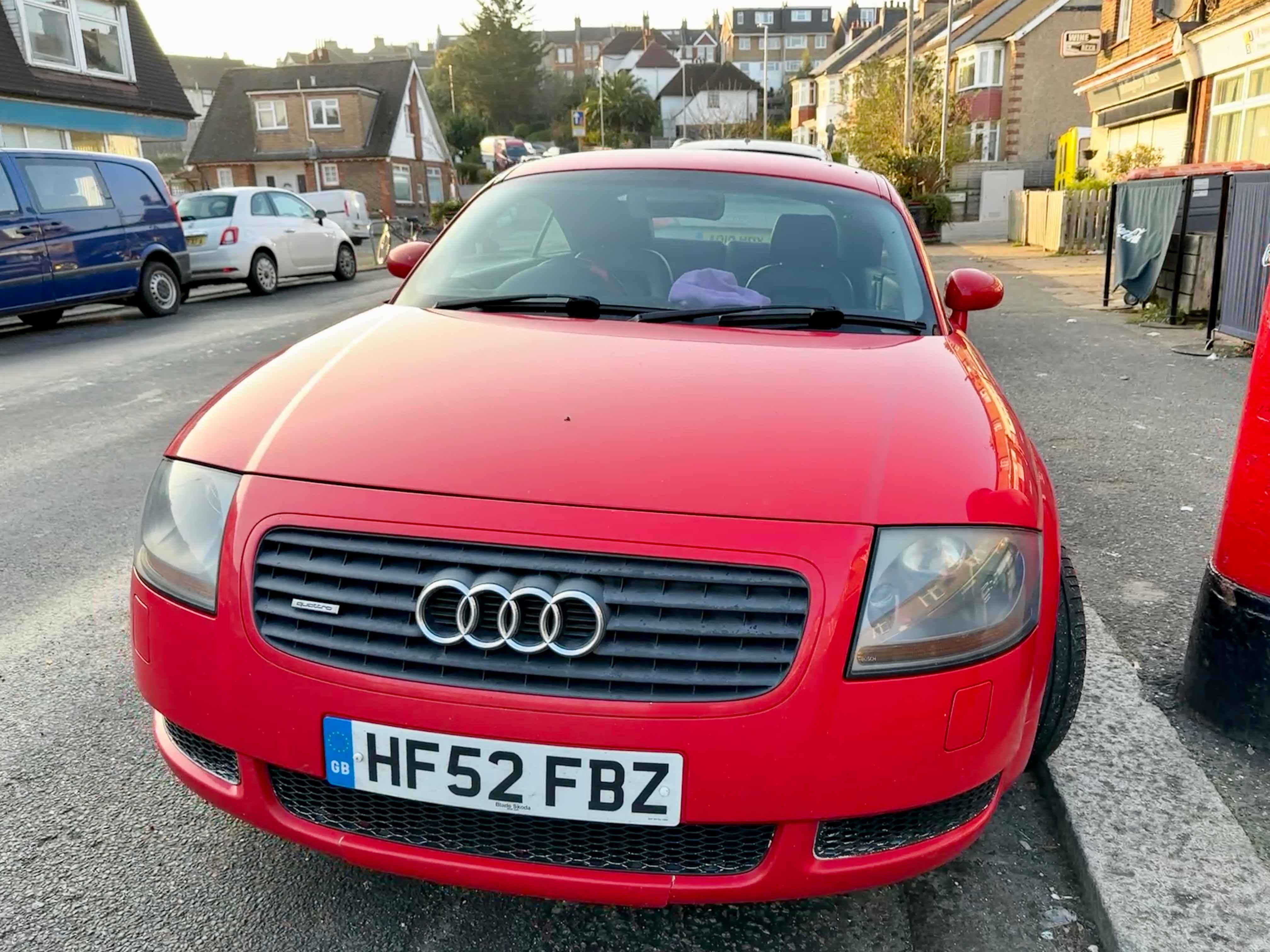 Photograph of HF52 FBZ - a Red Audi TT parked in Hollingdean by a non-resident, and potentially abandoned. The second of two photographs supplied by the residents of Hollingdean.