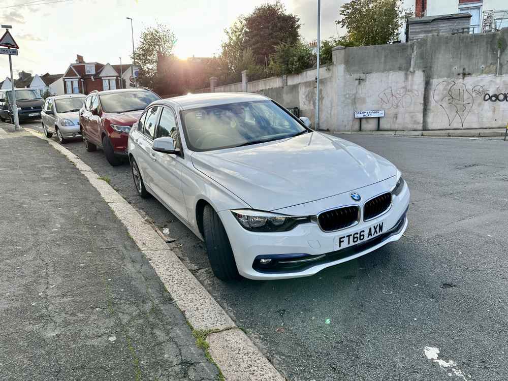 Photograph of FT66 AXW - a White BMW 3 Series parked in Hollingdean by a non-resident who uses the local area as part of their Brighton commute. The second of nine photographs supplied by the residents of Hollingdean.