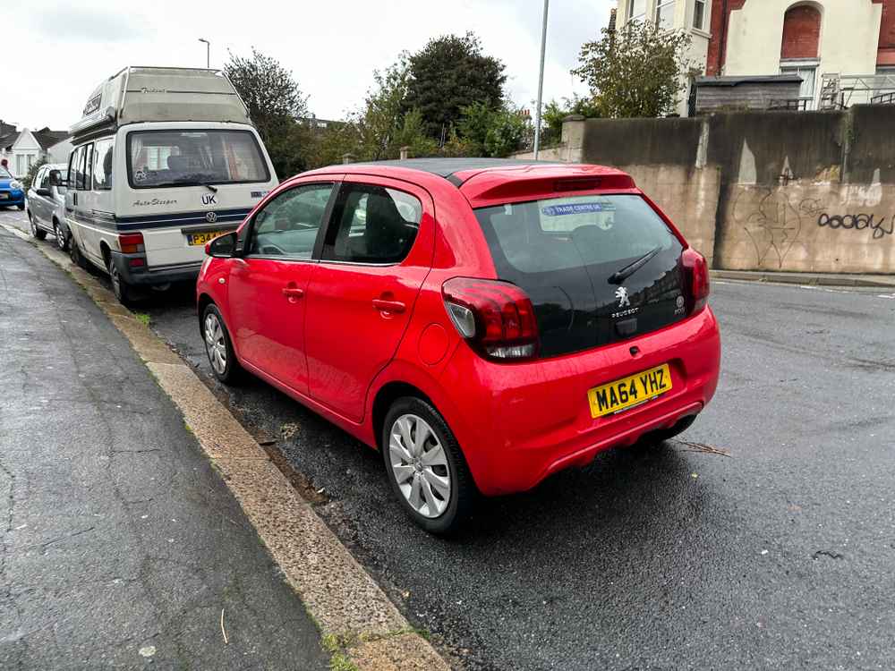 Photograph of MA64 YHZ - a Red Peugeot 108 parked in Hollingdean by a non-resident who uses the local area as part of their Brighton commute. The third of six photographs supplied by the residents of Hollingdean.