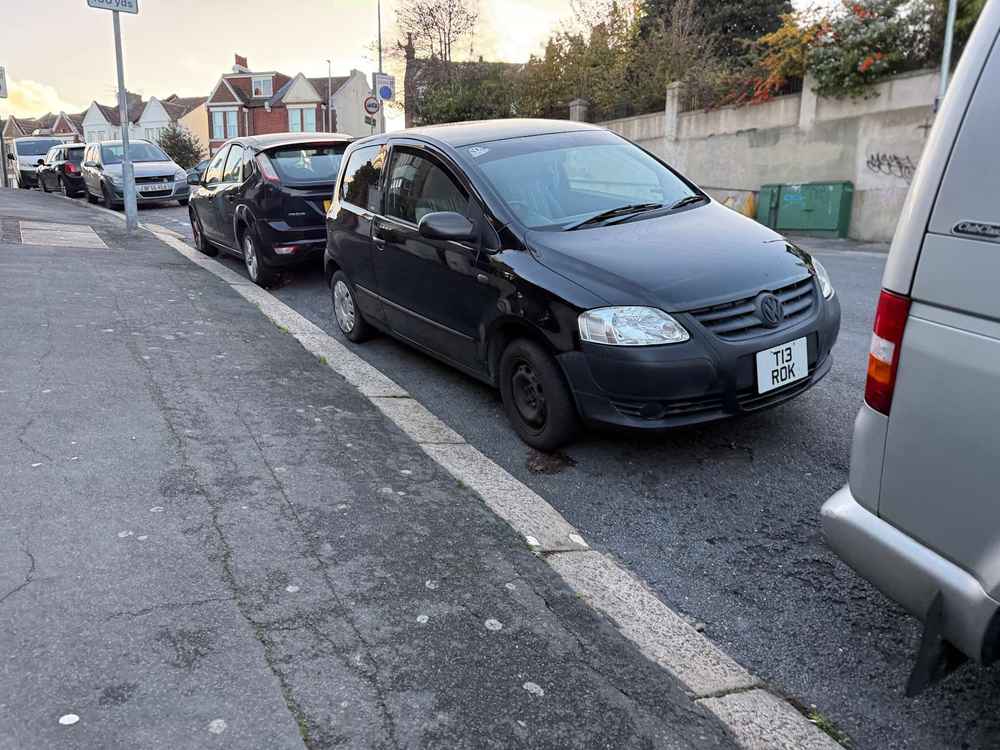 Photograph of T13 ROK - a Black Volkswagen Fox parked in Hollingdean by a non-resident. The first of four photographs supplied by the residents of Hollingdean.