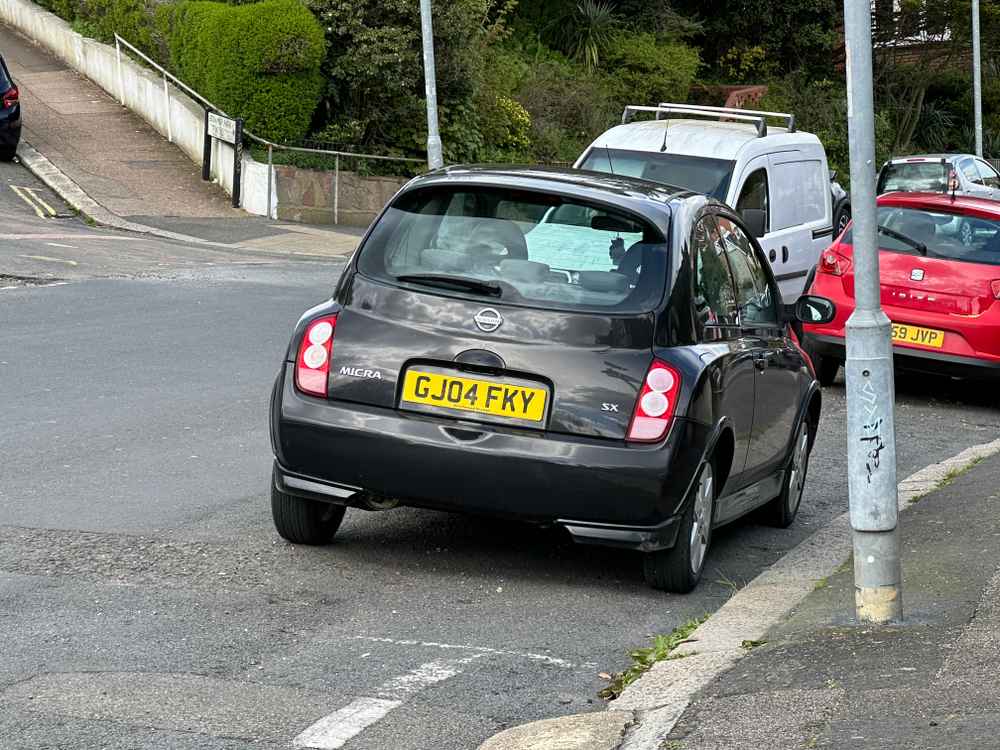 Photograph of GJ04 FKY - a Black Nissan Micra parked in Hollingdean by a non-resident. The second of six photographs supplied by the residents of Hollingdean.