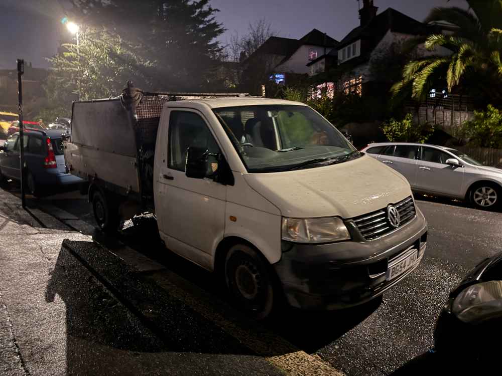 Photograph of BG54 JHU - a White Volkswagen T-Sporter parked in Hollingdean by a non-resident. The seventeenth of seventeen photographs supplied by the residents of Hollingdean.