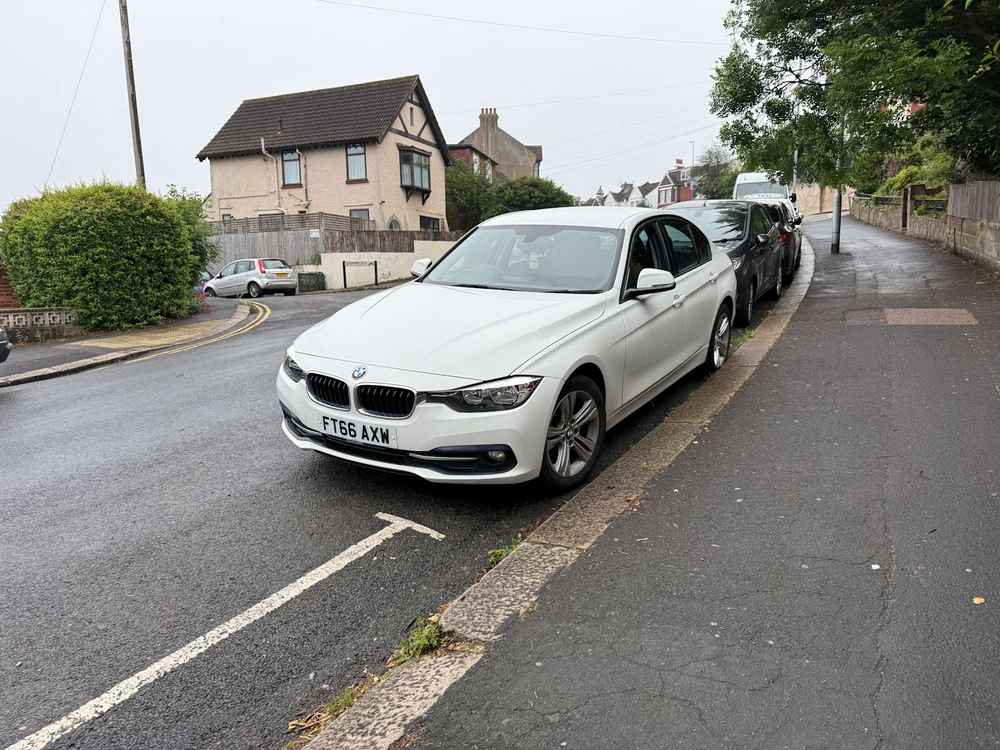 Photograph of FT66 AXW - a White BMW 3 Series parked in Hollingdean by a non-resident who uses the local area as part of their Brighton commute. The seventeenth of twenty-five photographs supplied by the residents of Hollingdean.