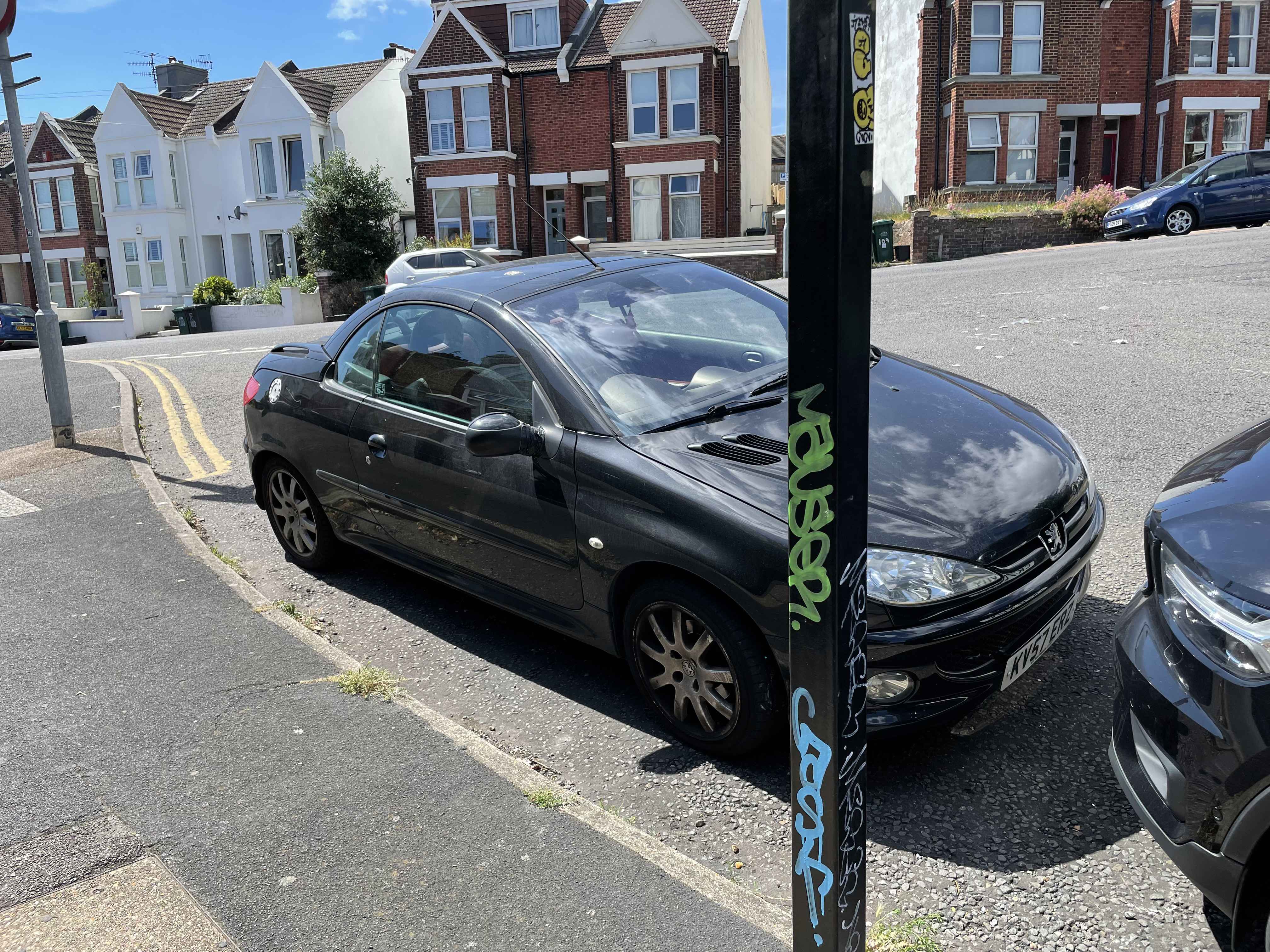 Photograph of KV57 ERZ - a Black Peugeot 206 parked in Hollingdean by a non-resident. The second of eight photographs supplied by the residents of Hollingdean.