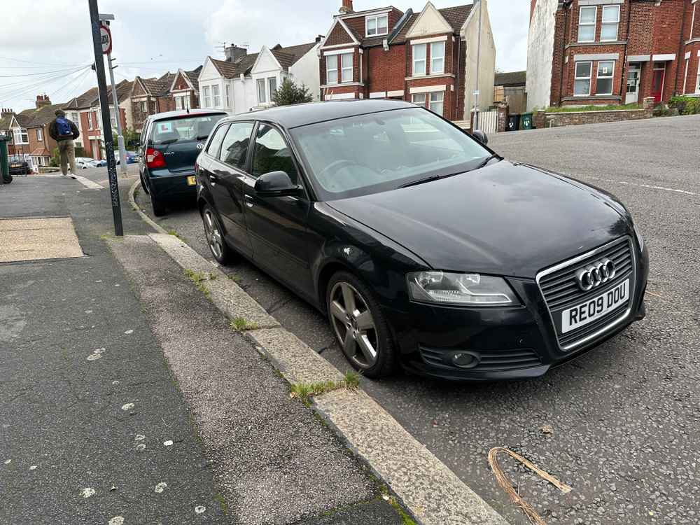 Photograph of RE09 DOU - a Black Audi A3 parked in Hollingdean by a non-resident who uses the local area as part of their Brighton commute. The fourth of eight photographs supplied by the residents of Hollingdean.