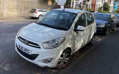 WJ12 XFC, a White Hyundai i10 parked in Hollingdean