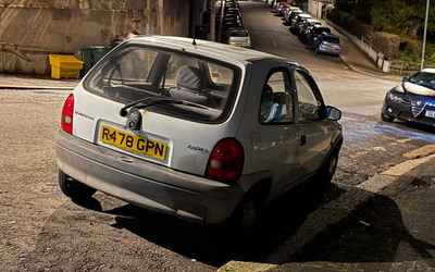 R478 GPN, a White Vauxhall Corsa parked in Hollingdean