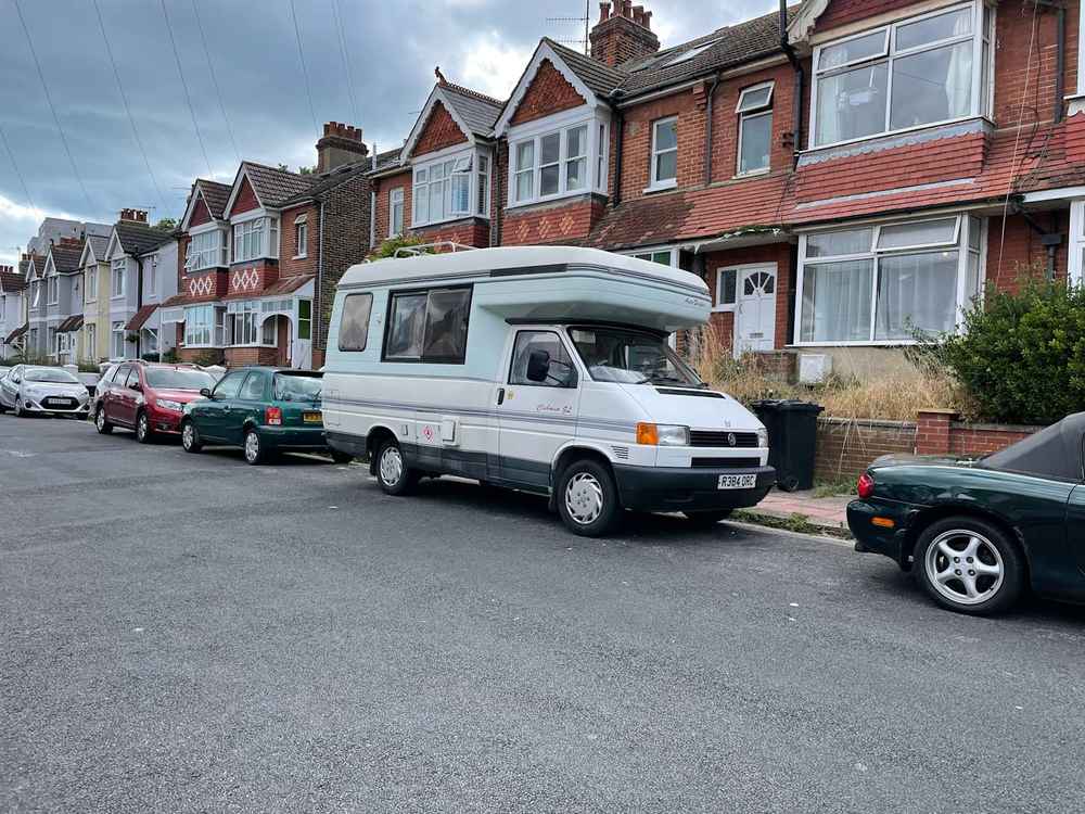 Photograph of R384 ORC - a Beige Volkswagen Transporter camper van parked in Hollingdean by a non-resident, and potentially abandoned. The second of fifteen photographs supplied by the residents of Hollingdean.