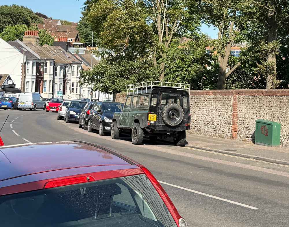 Photograph of R921 ENF - a Green Land Rover Defender parked in Hollingdean by a non-resident. The eighth of eight photographs supplied by the residents of Hollingdean.