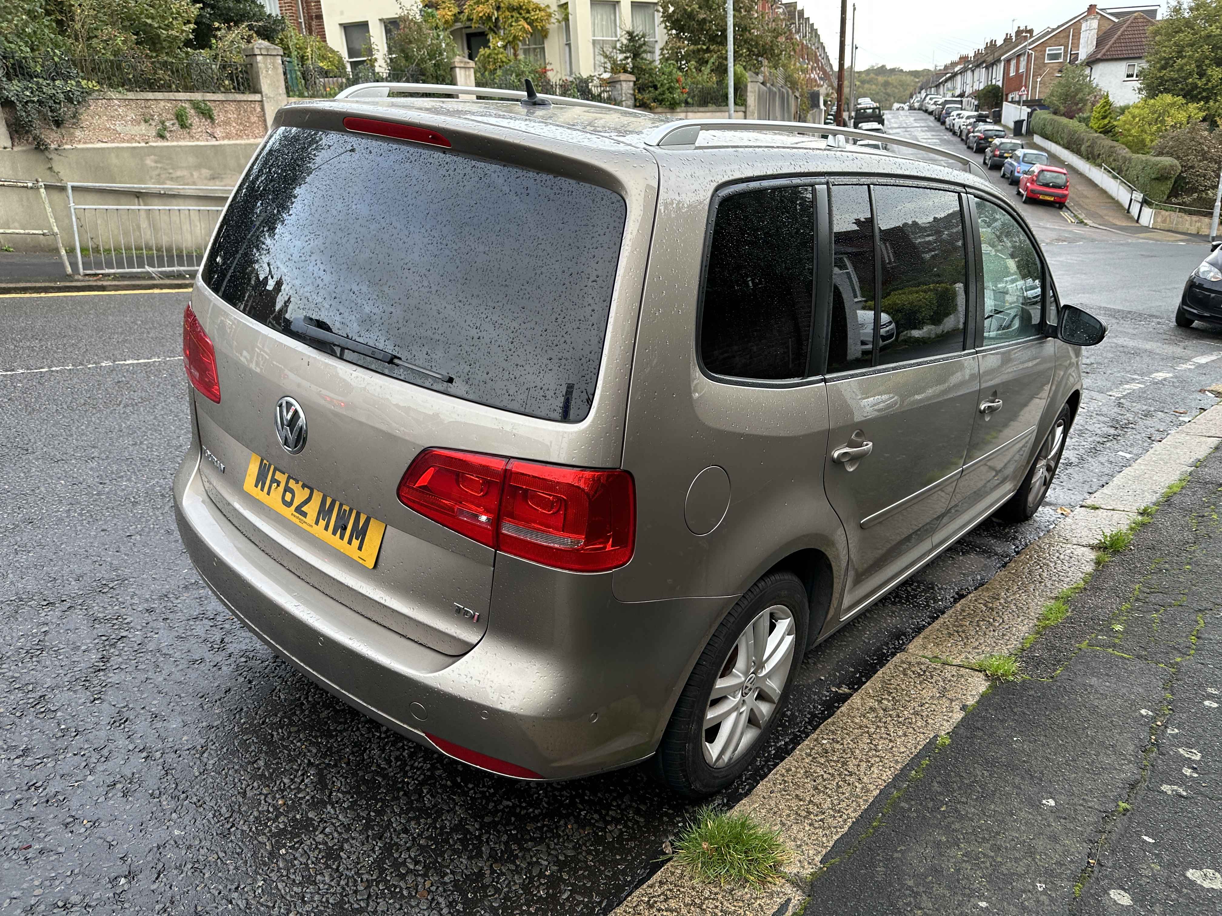Photograph of WF62 MWM - a Gold Volkswagen Touran parked in Hollingdean by a non-resident. 