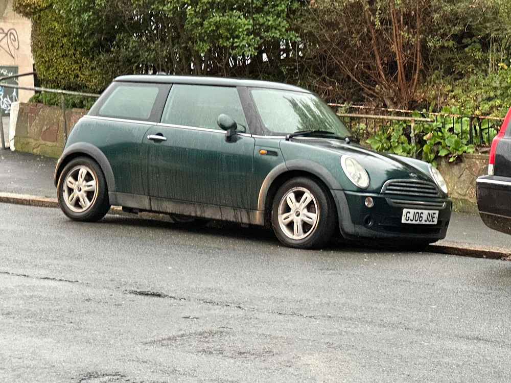 Photograph of GJ06 JUE - a Green Mini Cooper parked in Hollingdean by a non-resident. The fifth of twenty-four photographs supplied by the residents of Hollingdean.